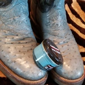 Women's black and turquoise Lucchese cowboy boots.